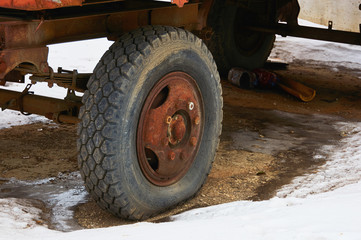 Old flat tire cracked from a big car.