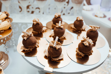 Candy Bar. Delicious sweet buffet with cupcakes. Wedding decorations. Awesome wedding reception. Stylish sweet candy bar set at the wedding ceremony, confectionery