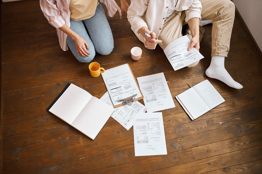 young people working with paper, document, cropped photo. family developing business. couple managing their badget