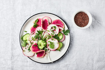 Salad with radish and cucumber.