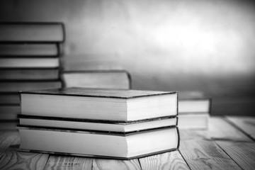 Textbooks and books on a wooden table