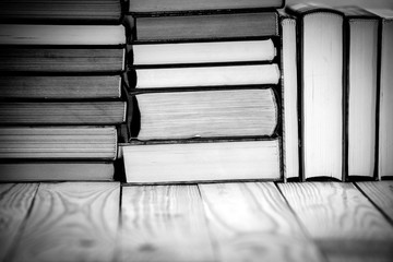 Textbooks and books on a wooden table