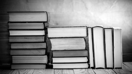 Textbooks and books on a wooden table