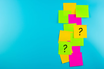Questions Mark ( ? ) word in paper note on blue background. FAQ( frequency asked questions), Answer, Q&A, Communication and Brainstorming, International Ask a Question day Concepts