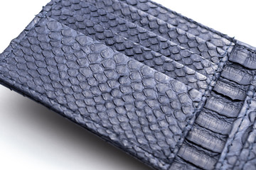 Snakeskin python leather wallet isolated on a white background.