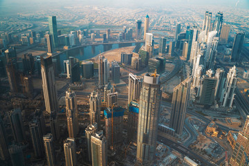 Fototapeta na wymiar Dubai skyline with skyscrapers in downtown aerial view from above. Morning in futuristic luxury city with many high buildings.
