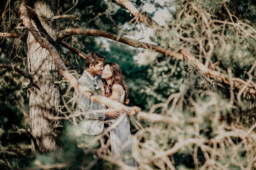 Kissing newlyweds couple. Outdoors  wedding ceremony.