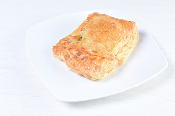 Chicken pie on white wooden background