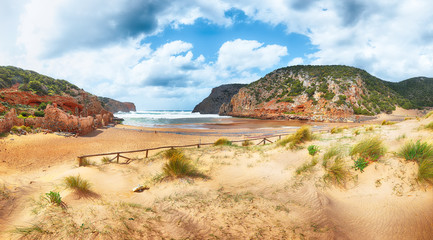 Charming view of beach Cala Domestica  with marvelous sand dunes.
