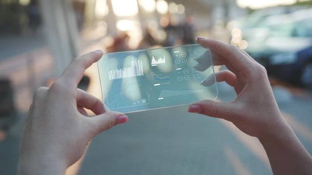 Future Horizontal Smartphone. Business Background. The Woman Use Smartphone with Futuristic Design. Multimedia Technology. Concept of Digital Future. Augmented Reality. Technology of Holographic