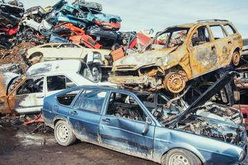 Crushed cars stacked up for recycling. 