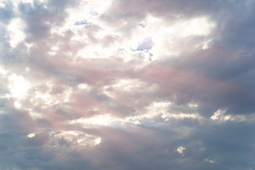 Dramatic cloudy sky with sun rays