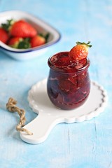 Strawberry marmelade. Homemade strawberry jam in glass jar and fresh strawberry. Copy space