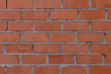 The surface of the rows of brick walls of red ceramic bricks