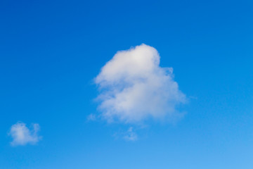Bright white clouds on blue sky. Beautiful background.