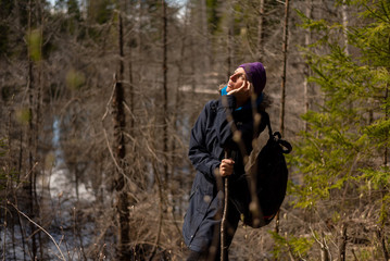 An adult woman wanders around the swamp.