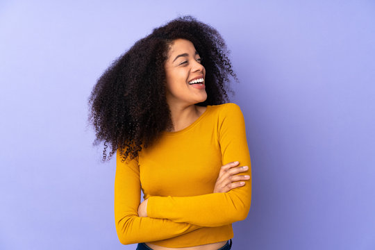 Young african american woman isolated on purple background happy and smiling