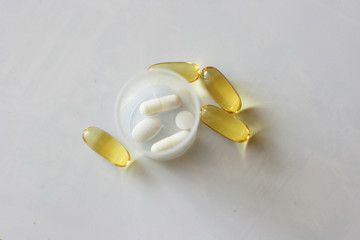 Tablets and pills laying on table. Background for pharmacology. Medicament composition.