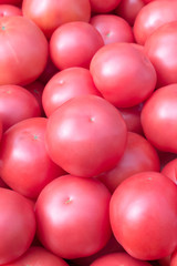 Pink (variety of tomatoes) tomatoes background.Market,  store shelves.
