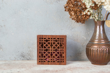 Vintage wooden aroma box on concrete background.