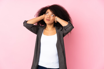 Young african american woman over isolated background frustrated and covering ears