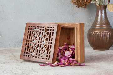 Vintage wooden aroma box on concrete background.