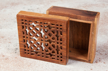 Vintage wooden aroma box on concrete background.