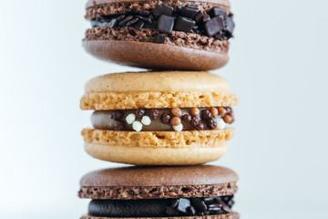 Assorted French macarons stacked on top of one another