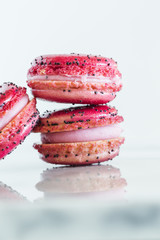 Assorted French macarons stacked on top of one another