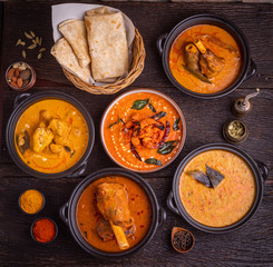 Assorted indian food on rustic wood.