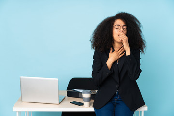 African american business woman working in her workplace is suffering with cough and feeling bad