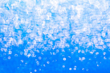 Background with light blue gradient sequin texture. Glitter background for Holiday and party banner.