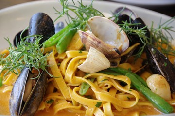 Creative gourmet pasta dish with mussels and clams