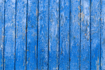 Blue wooden background. Blue faded painted wooden texture, background, wallpaper. Wooden background, painted surface blue boards.  Weathered blue wood background texture. Vertical  planks