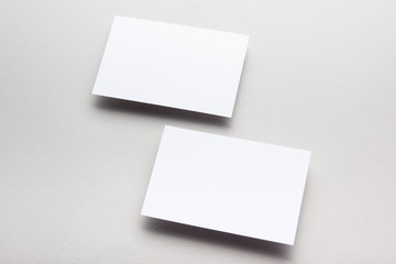 Business card blank on wooden background. Corporate Stationery, Branding Mock-up. Creative designer desk. Flat lay. Copy space for text