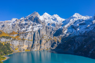 Aerial view on Lake Oeschinen with Blumlisalp mountain range, Kandersteg, Berner Oberland, Switzerland