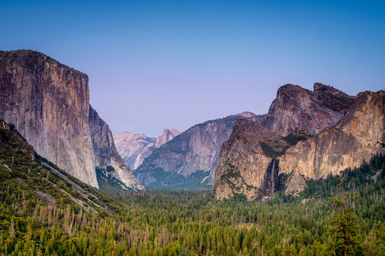 Idyllic shot of alpine forest amidst rocky mountains at Tunnel View, Yosemite National Park, Sierra Nevada, Central California, California, USA