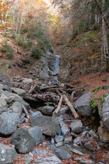 Autumn mountain river slope down