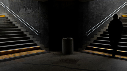 Symmetrical tunnel and stairs underground subway station