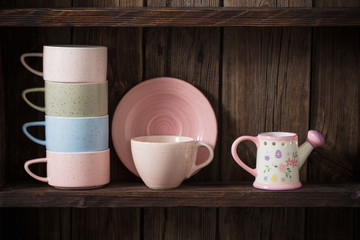  kitchen dishware on old dark wooden background