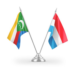 Luxembourg and Comoros table flags isolated on white 3D rendering