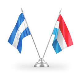 Luxembourg and Honduras table flags isolated on white 3D rendering