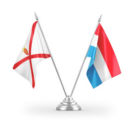 Luxembourg and Jersey table flags isolated on white 3D rendering