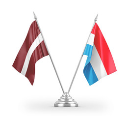 Luxembourg and Latvia table flags isolated on white 3D rendering