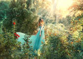 Fairytale nymph enjoy bright sun in green forest. Hairstyle decorated blue flowers flowing hair....