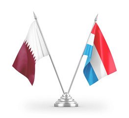 Luxembourg and Qatar table flags isolated on white 3D rendering