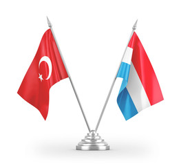 Luxembourg and Turkey table flags isolated on white 3D rendering
