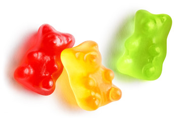 Three tasty jelly gummy bears, isolated on white background