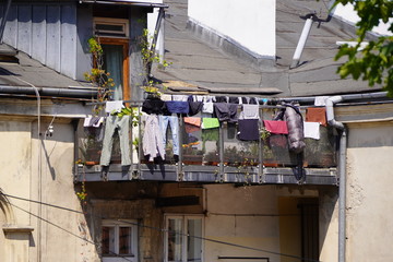 drying things on balcony or railing is old way to dry things. the unfolding of things in the sun, pull the ropes between the houses for drying things on the balcony or railing 