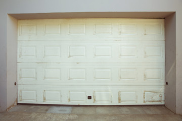 Shutter door or roller door and concrete floor outside .White Automatic shutters in a house . gates...